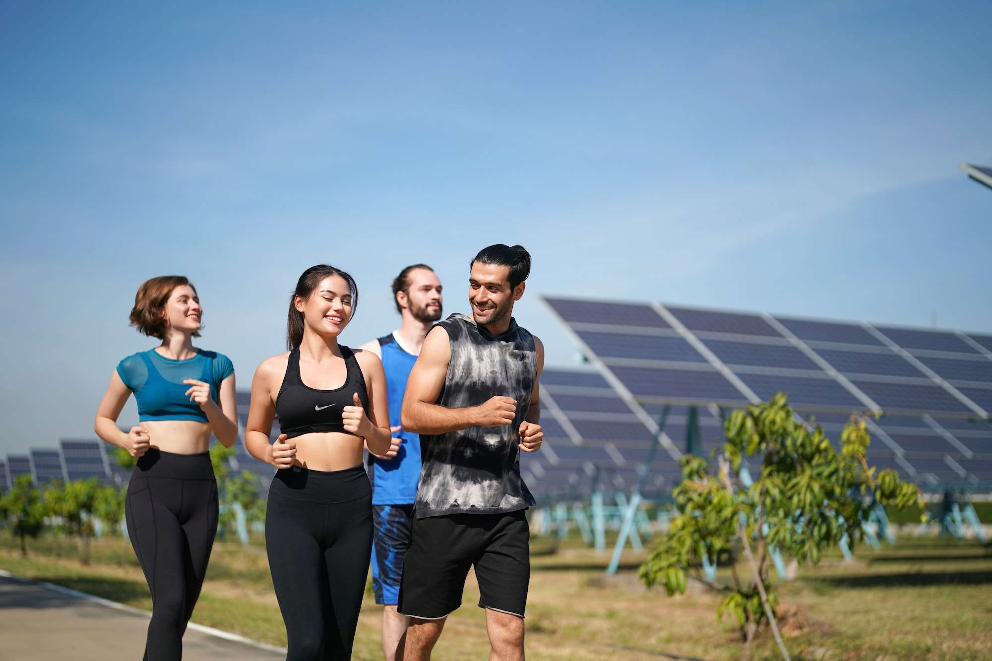 Solar Panels Farm Runner Active Man Athlete Jogging By Outdoor Background Header Panoramic